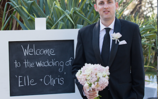 groom holding bouquet at Noosa Weddig